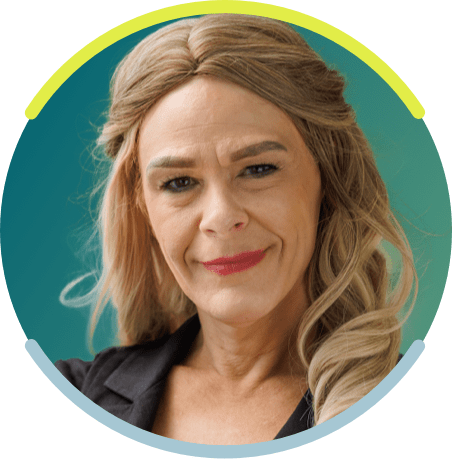 A white woman with long blonde hair faces the camera with a neutral smile